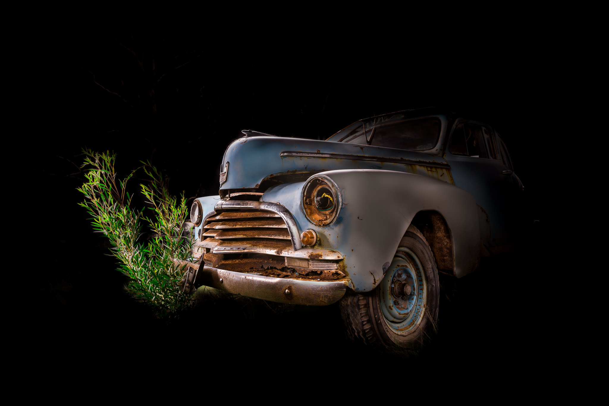 Automotive photography of 1950's Chevrolet front quarter at Night